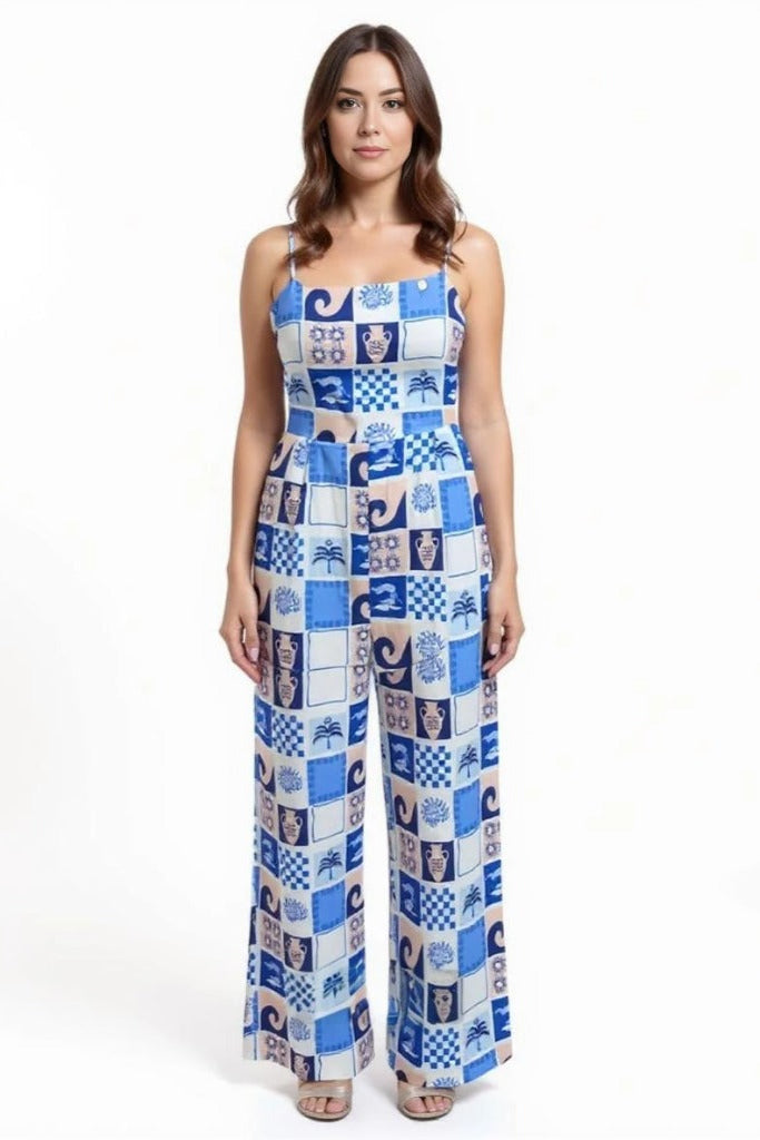Woman wearing a patterned jumpsuit on a white background