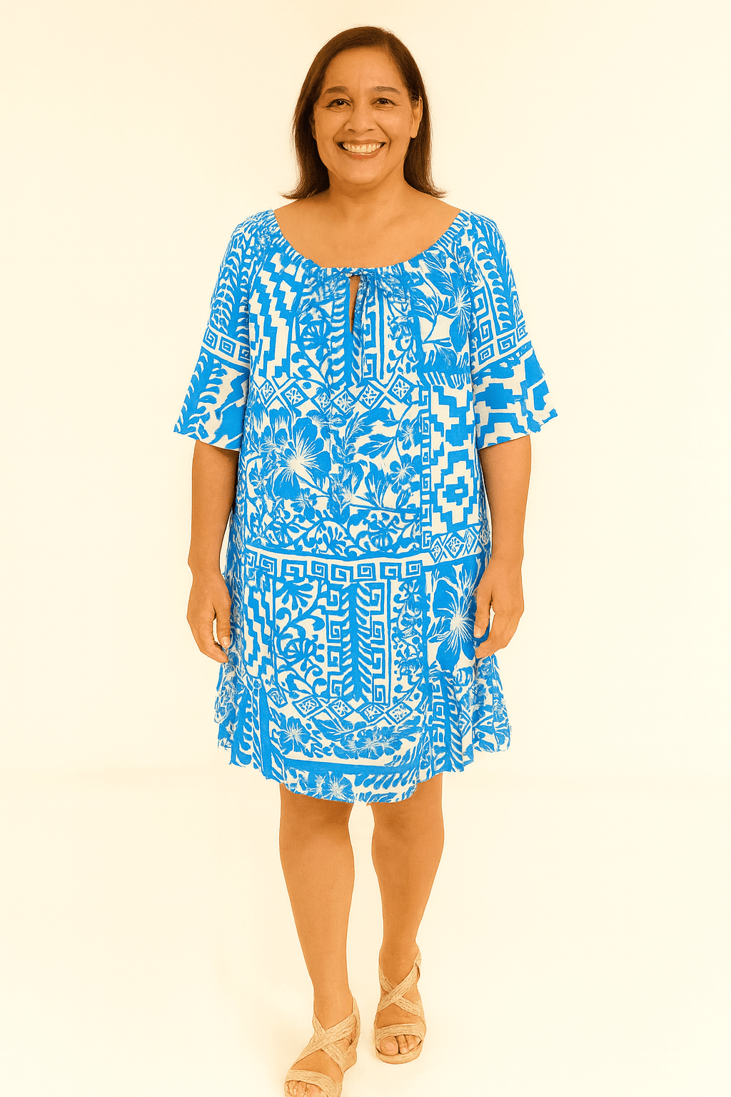 Sandy Floral Print Summer DressEmbrace island style with the Sandy Floral Print Summer Dress. Blue & white floral print, lightweight fabric, relaxed fit & tie neckline for summer comfort.
